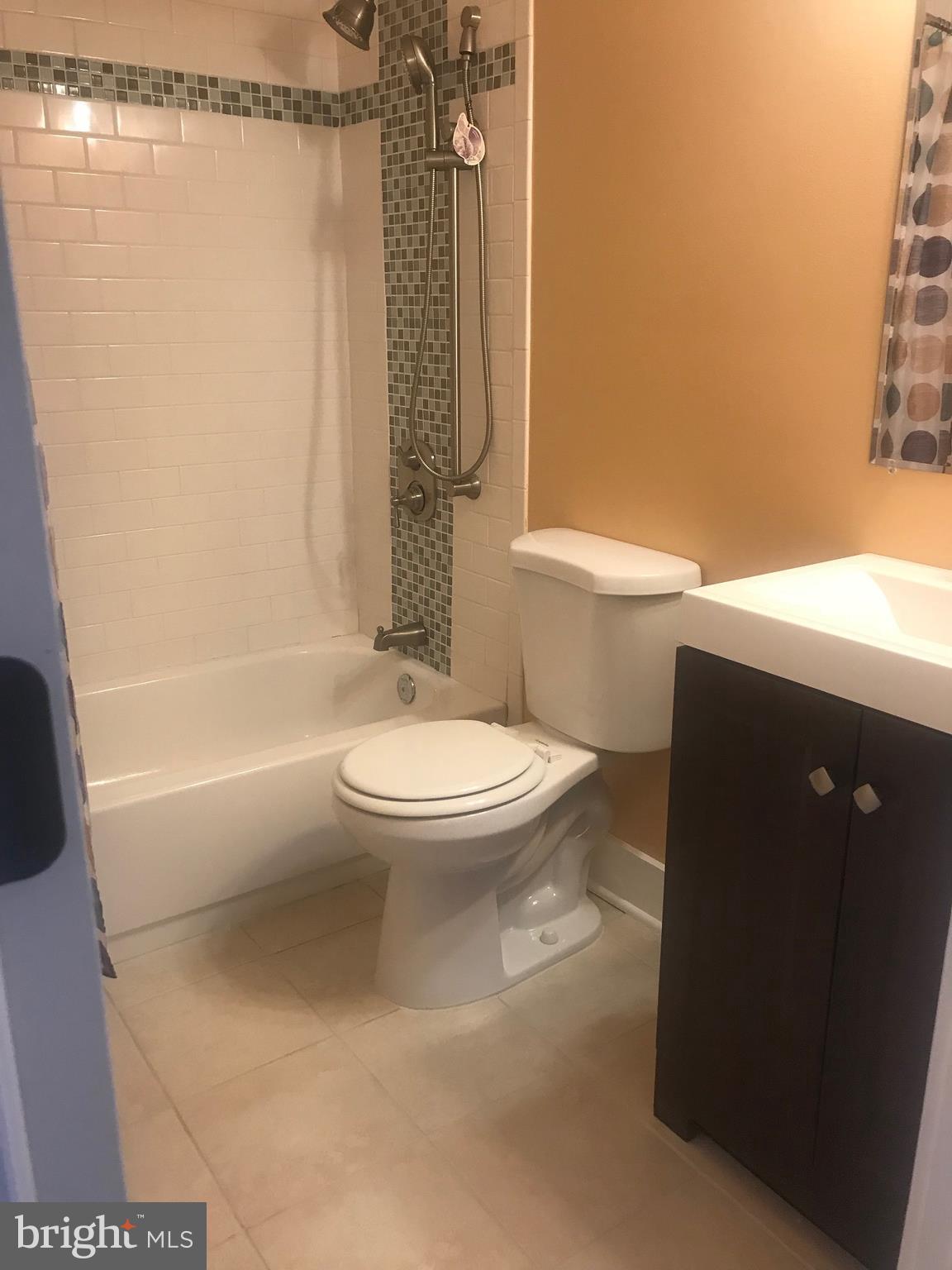 772 223rd Street Pasadena, MD 21122 - Photo 12 of 13 a bathroom with a toilet and a shower