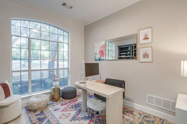 a workspace with furniture and window