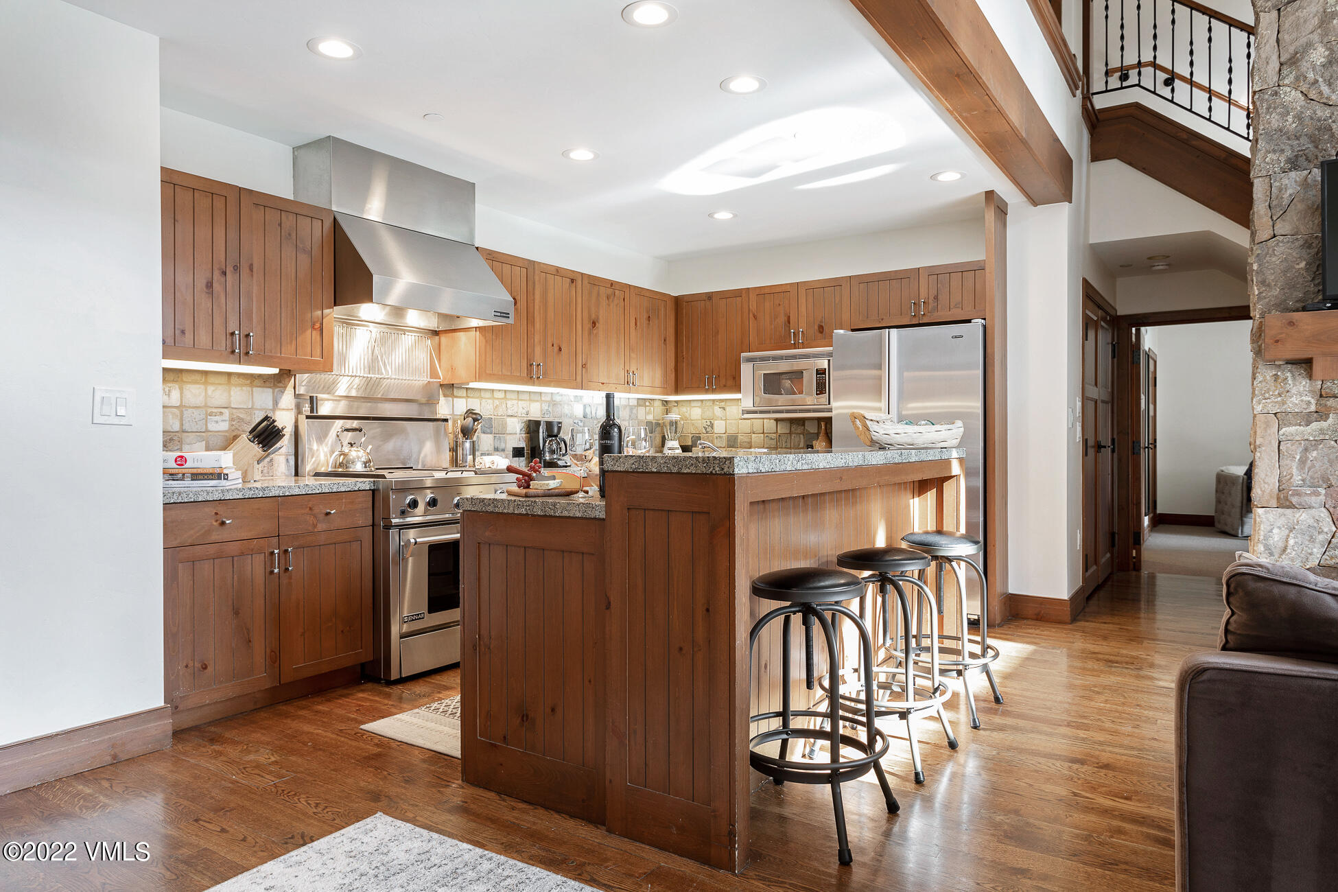 180 Daybreak Ridge Road, Unit 813 Avon, CO 81620 - Photo 11 of 46 a kitchen with stainless steel appliances granite countertop a refrigerator and a stove top oven
