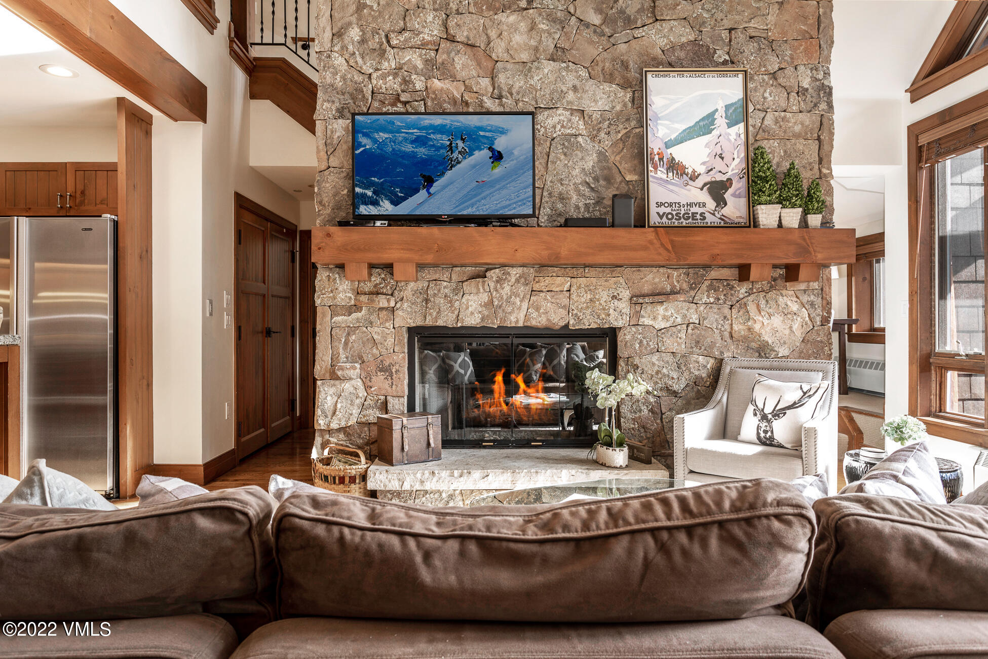 180 Daybreak Ridge Road, Unit 813 Avon, CO 81620 - Photo 12 of 46 a living room with furniture and a fireplace