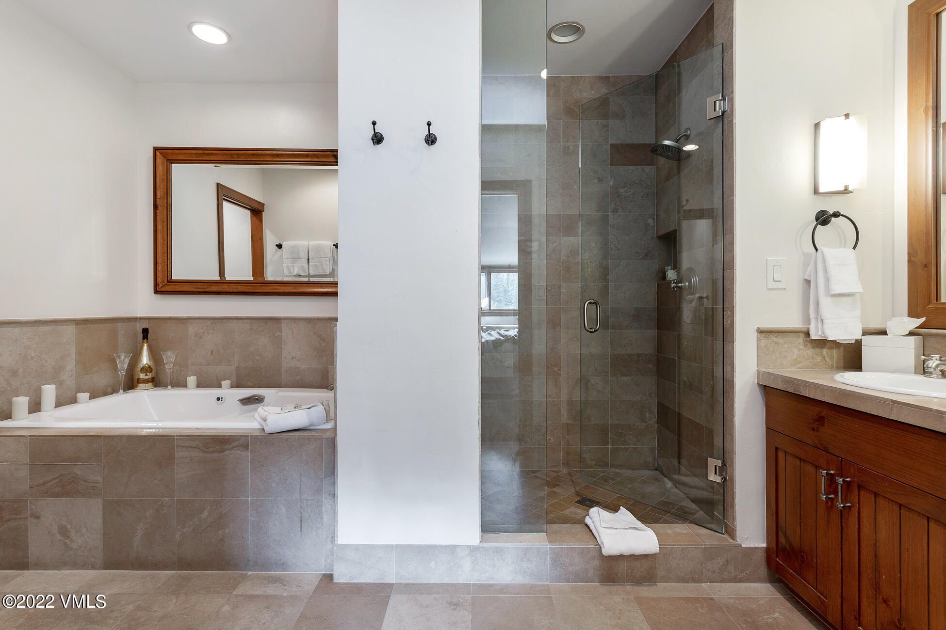 180 Daybreak Ridge Road, Unit 813 Avon, CO 81620 - Photo 18 of 46 a bathroom with a double vanity sink mirror and shower