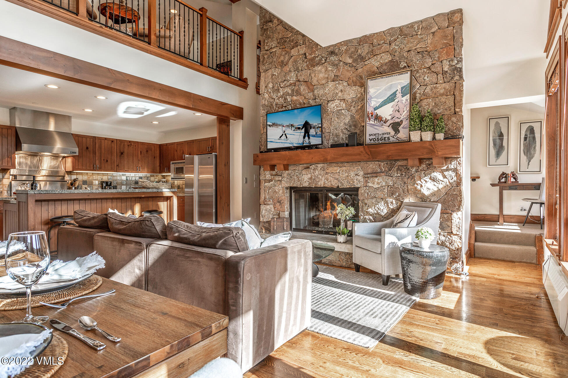 180 Daybreak Ridge Road, Unit 813 Avon, CO 81620 - Photo 2 of 46 a living room with furniture and a fireplace