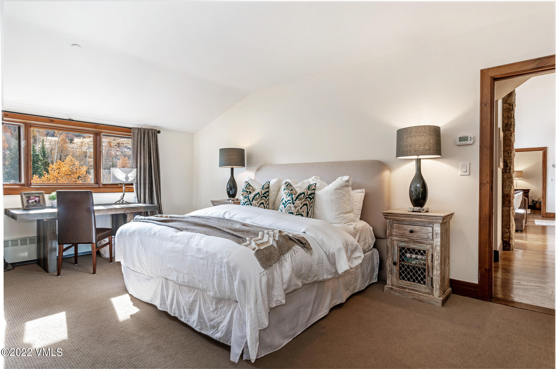 180 Daybreak Ridge Road, Unit 813 Avon, CO 81620 - Photo 22 of 46 a spacious bedroom with a bed and window