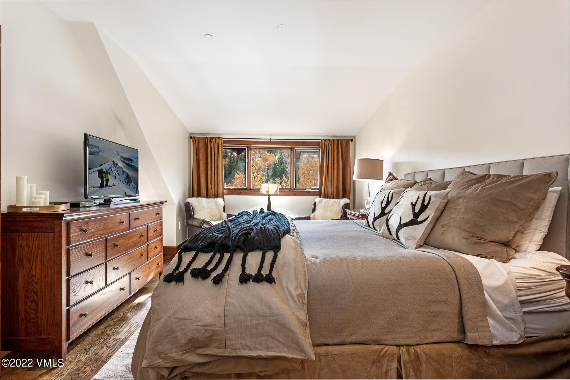 180 Daybreak Ridge Road, Unit 813 Avon, CO 81620 - Photo 24 of 46 a living room with furniture fireplace and a flat screen tv