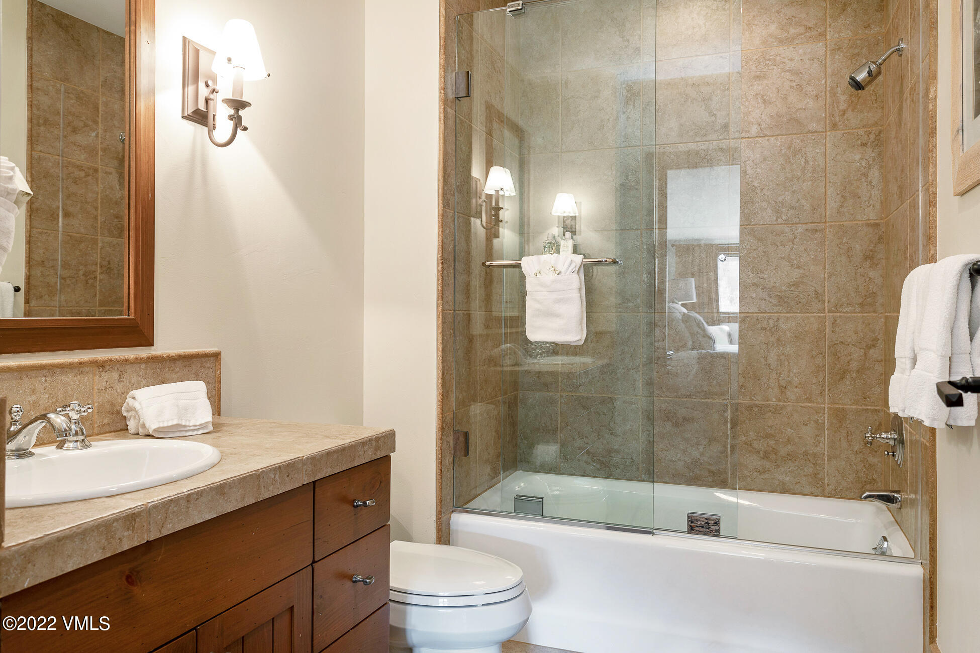 180 Daybreak Ridge Road, Unit 813 Avon, CO 81620 - Photo 25 of 46 a bathroom with a sink a toilet and shower