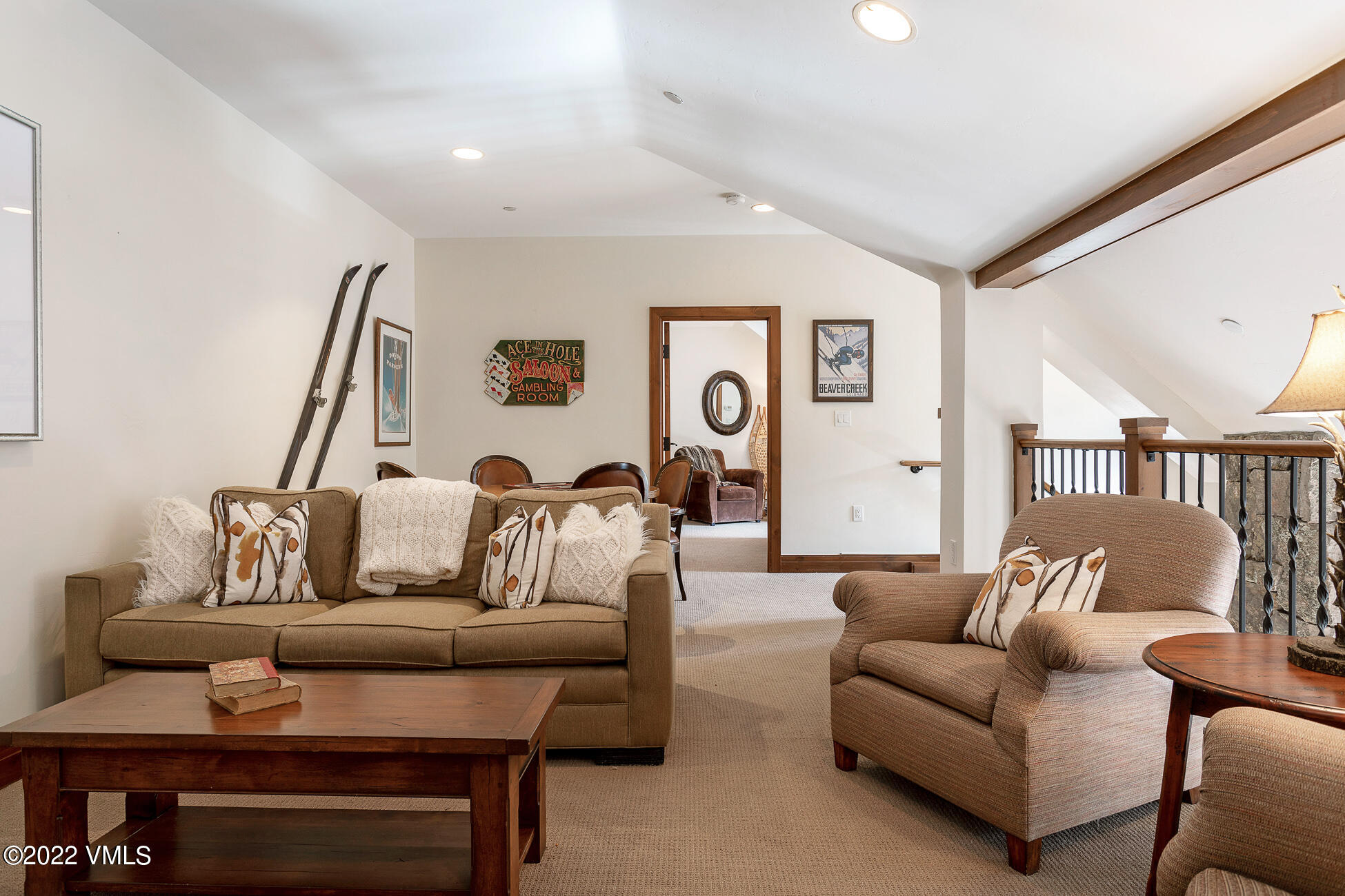 180 Daybreak Ridge Road, Unit 813 Avon, CO 81620 - Photo 28 of 46 a living room with furniture and a night stand