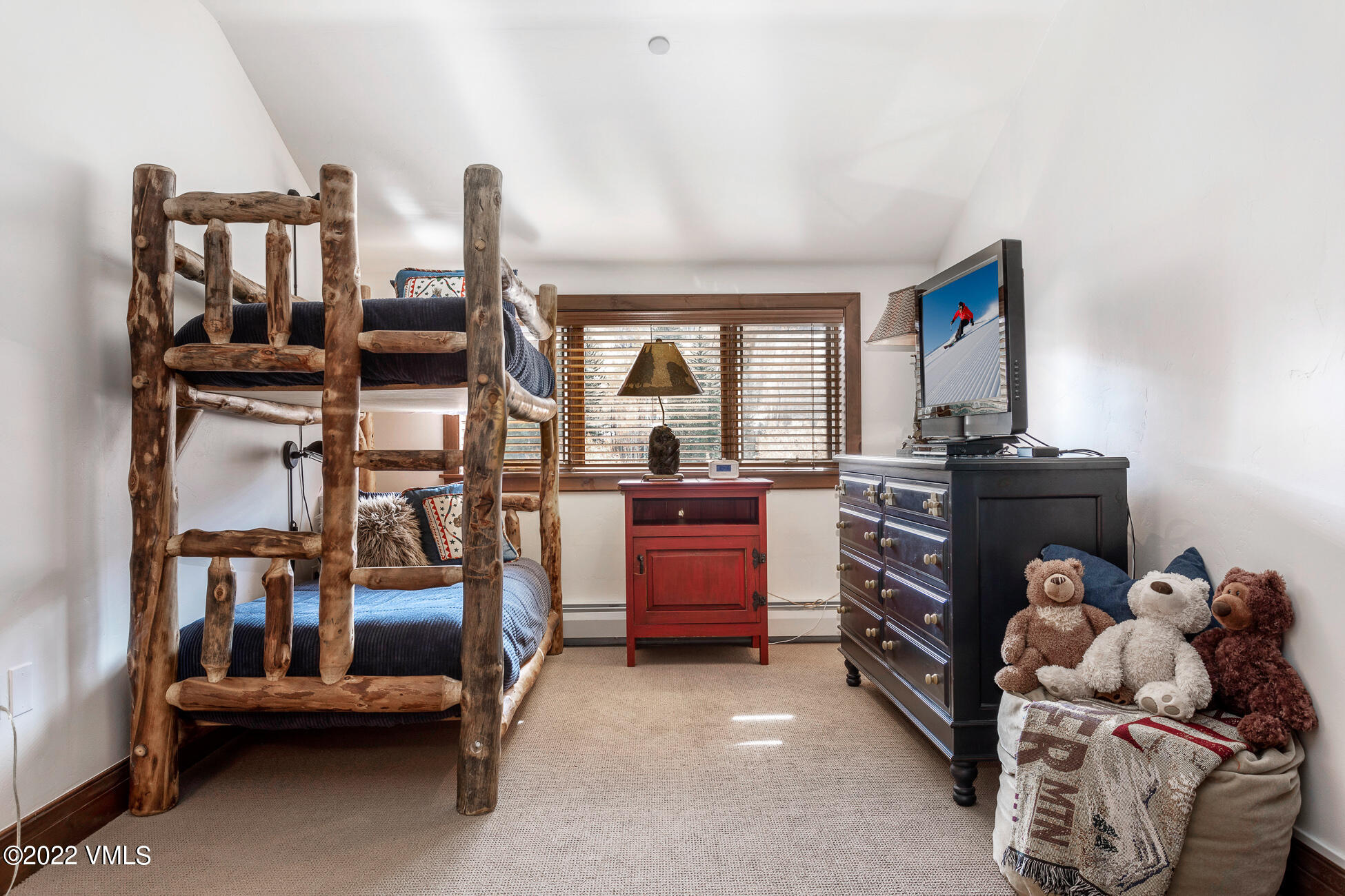 180 Daybreak Ridge Road, Unit 813 Avon, CO 81620 - Photo 30 of 46 a room with furniture and a window