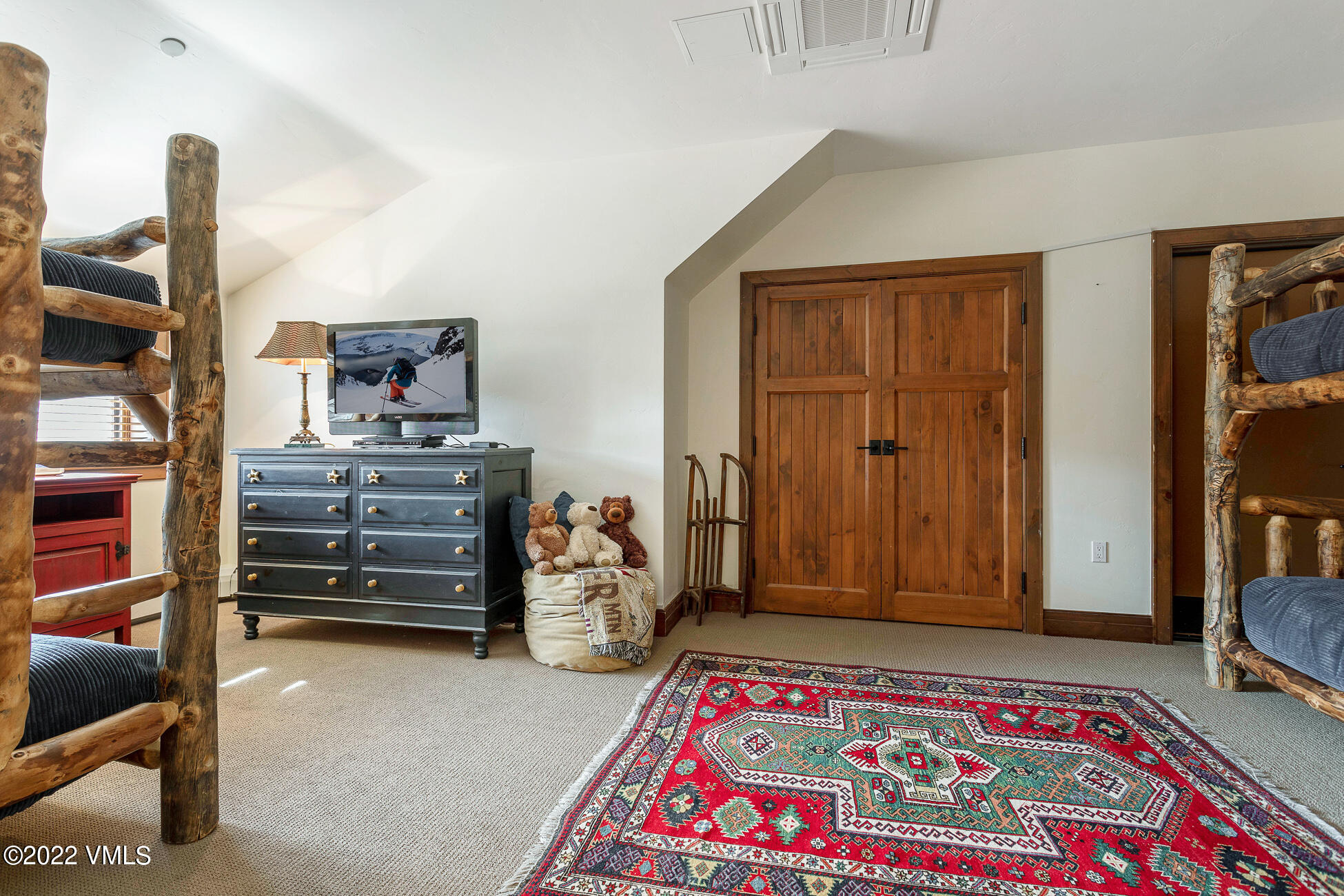 180 Daybreak Ridge Road, Unit 813 Avon, CO 81620 - Photo 32 of 46 a bedroom with furniture and a closet