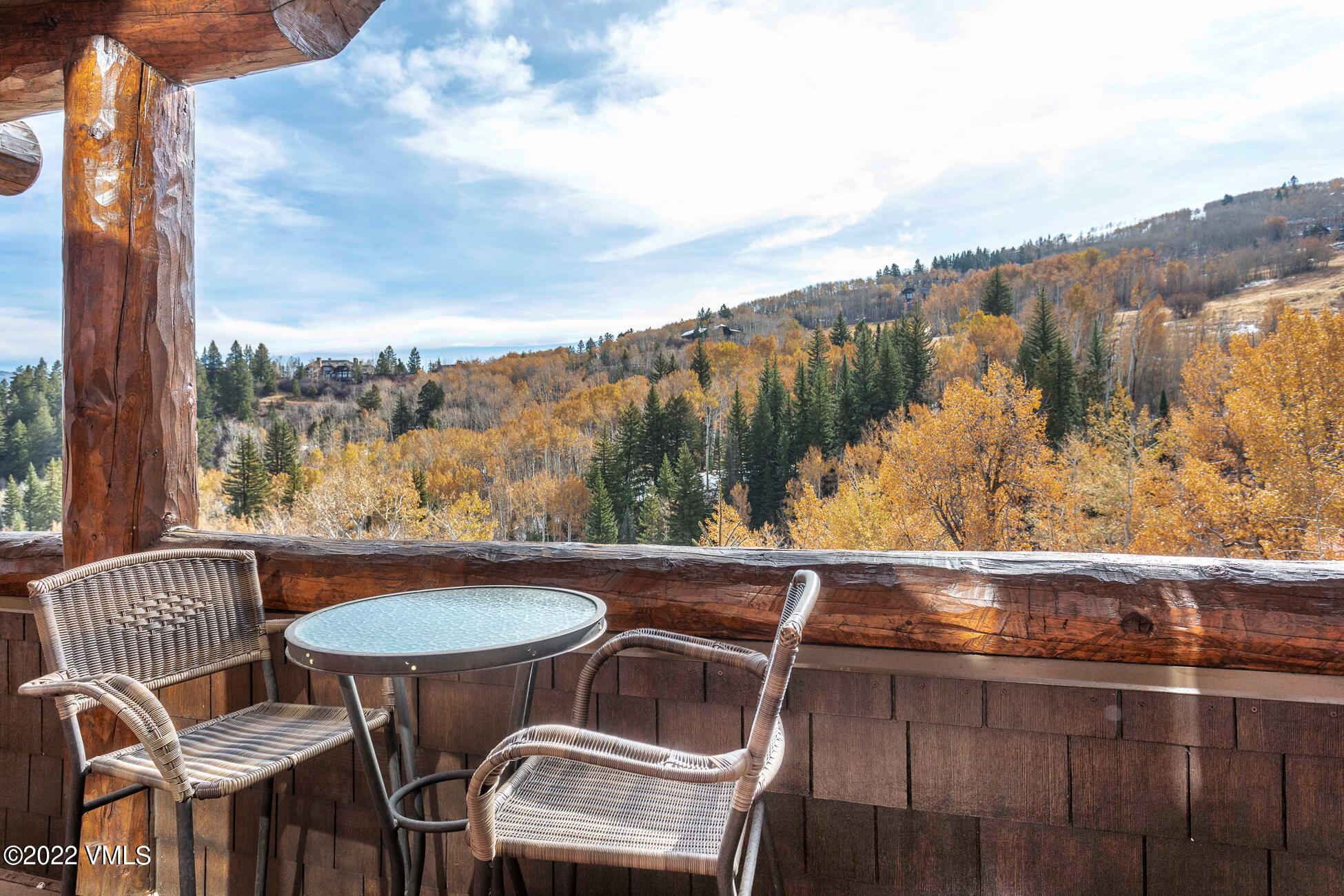 180 Daybreak Ridge Road, Unit 813 Avon, CO 81620 - Photo 37 of 46 a view of a chairs and table in the balcony