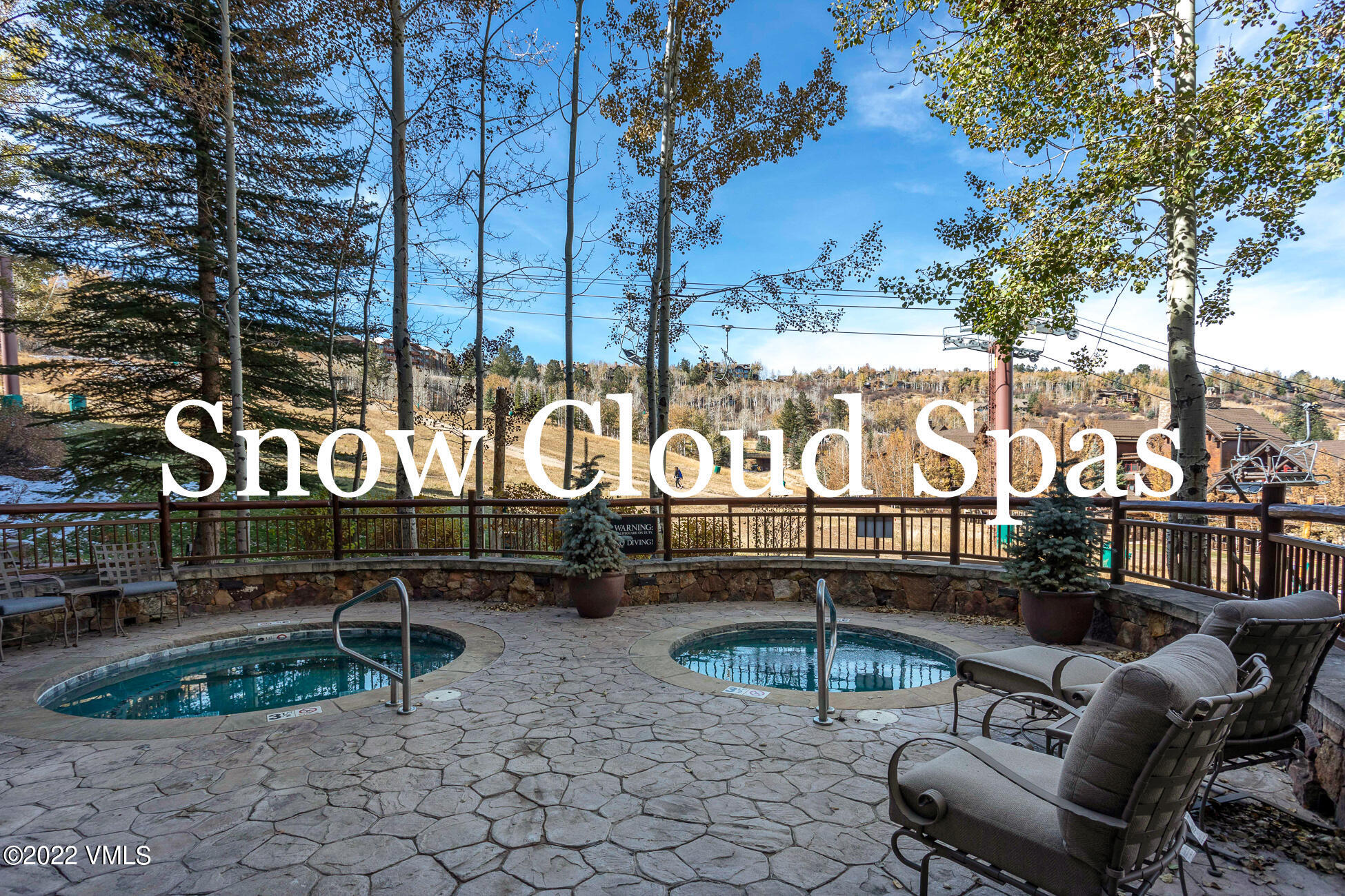 180 Daybreak Ridge Road, Unit 813 Avon, CO 81620 - Photo 45 of 46 a view of outdoor space with seating area and trees