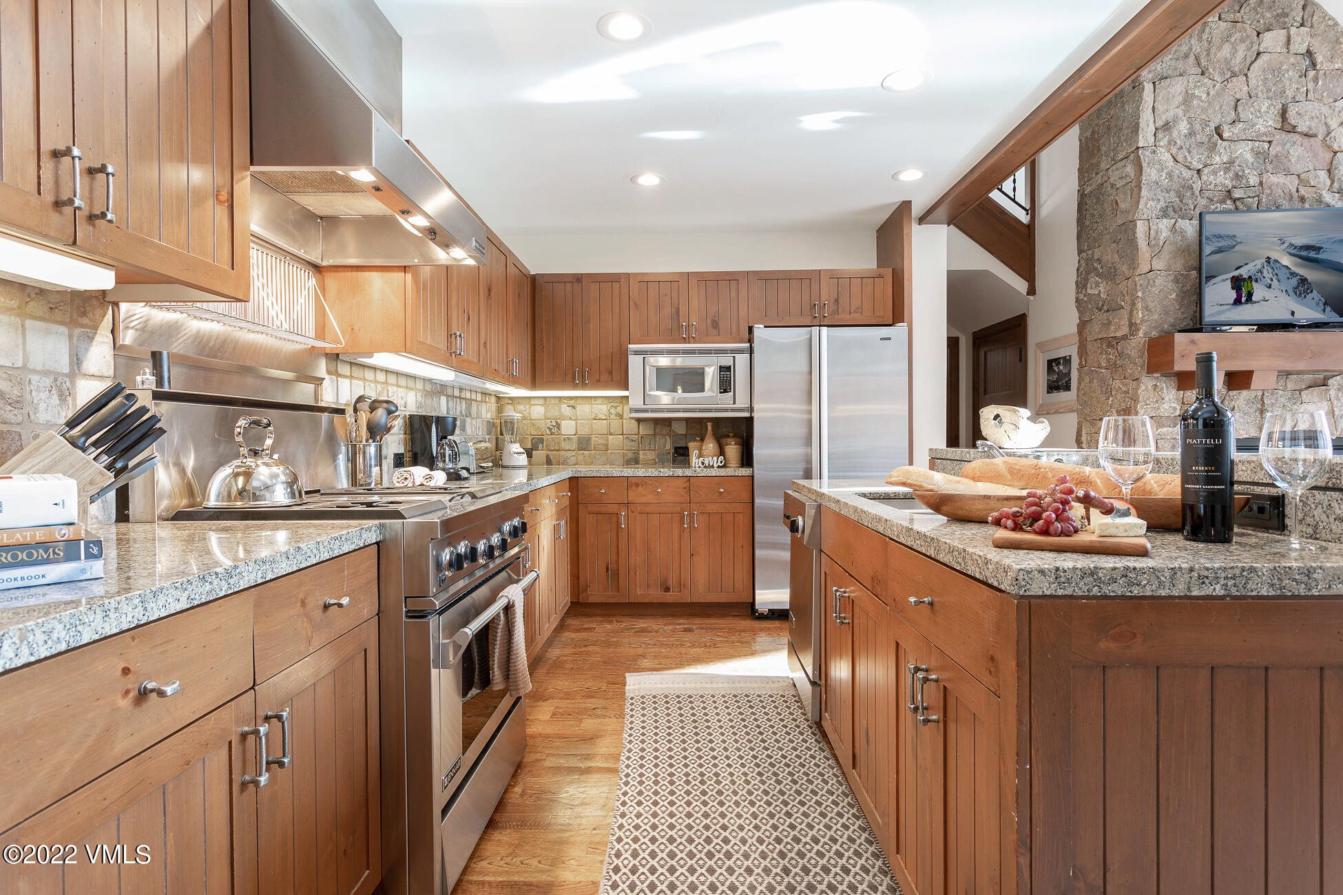 180 Daybreak Ridge Road, Unit 813 Avon, CO 81620 - Photo 7 of 46 a kitchen with stainless steel appliances granite countertop a sink and a stove