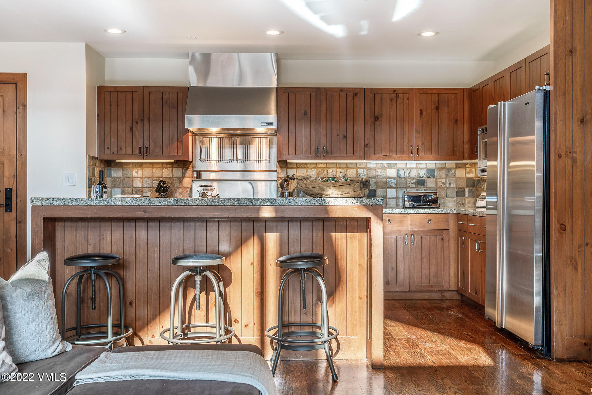 180 Daybreak Ridge Road, Unit 813 Avon, CO 81620 - Photo 10 of 46 a kitchen with stainless steel appliances granite countertop a refrigerator and a sink