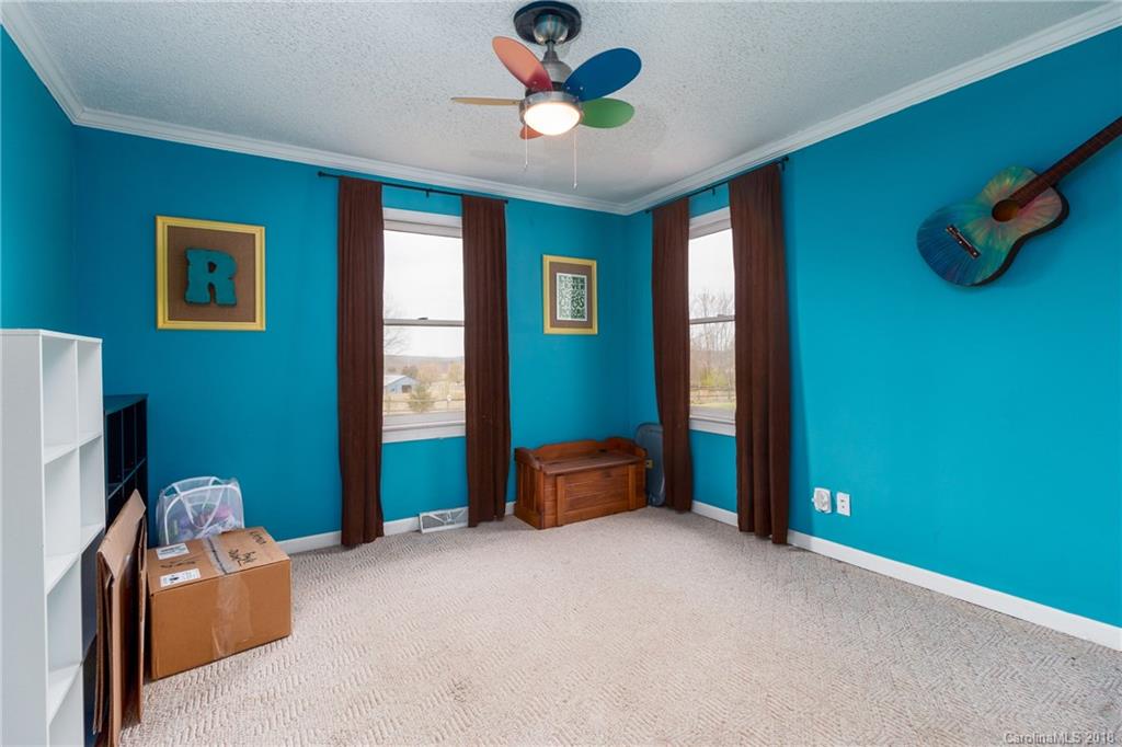 1798 George Brown Road Crouse, NC 28033 - Photo 8 of 31 a bedroom with window and a ceiling fan