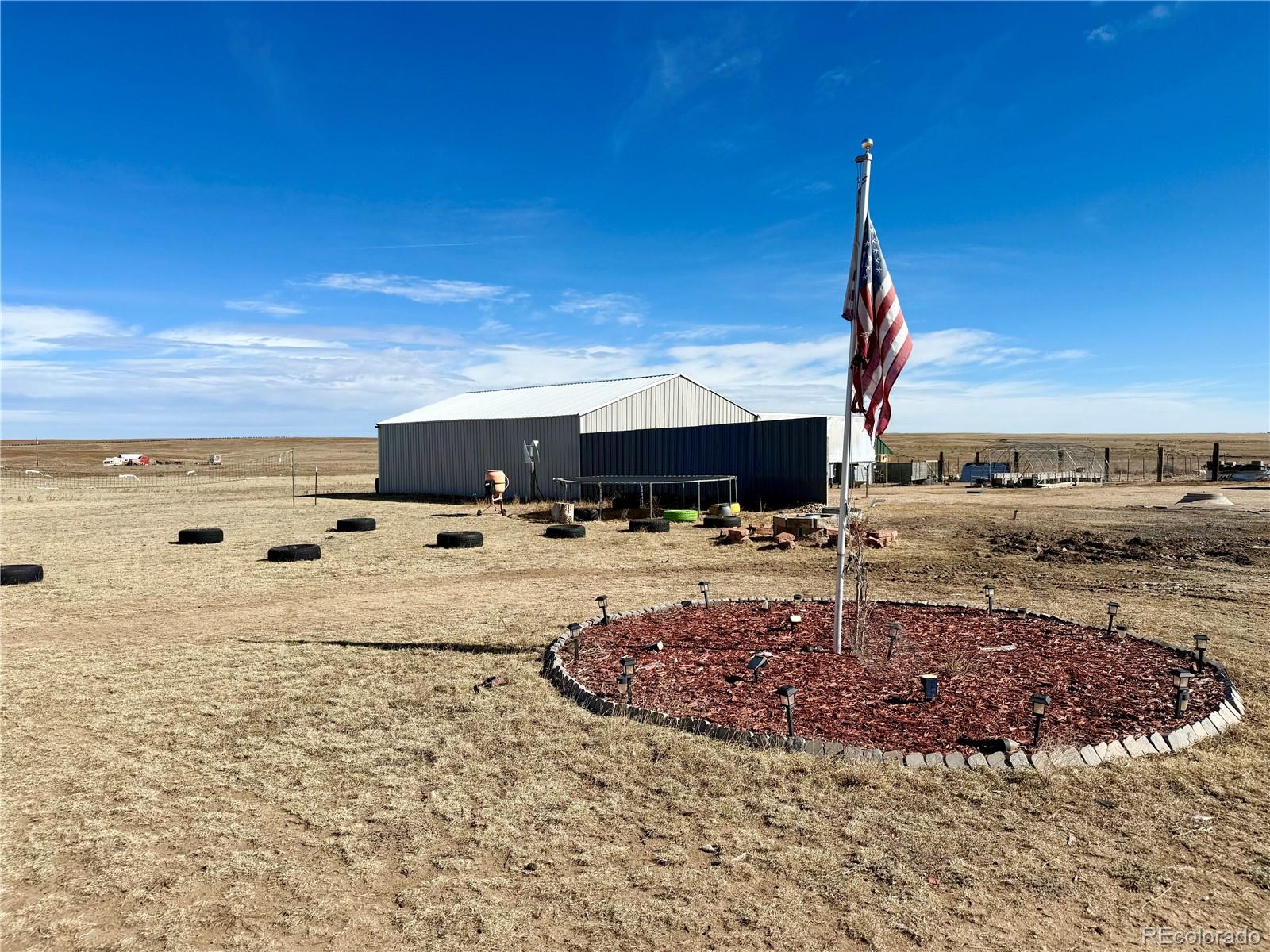 11101 Berridge Road Calhan, CO 80808 - Photo 1 of 11 a view of a swimming pool with a yard