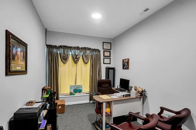 a workspace with furniture and window