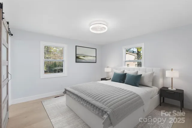 a bedroom with a bed and a lamp