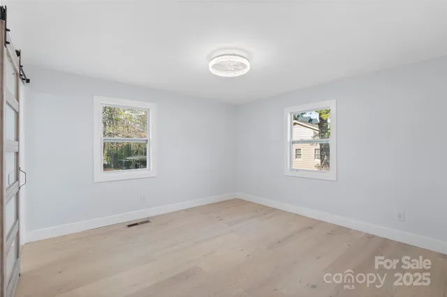 an empty room with windows