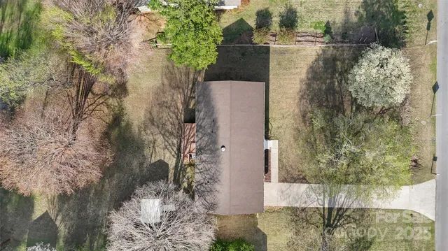 a aerial view of a house with a yard