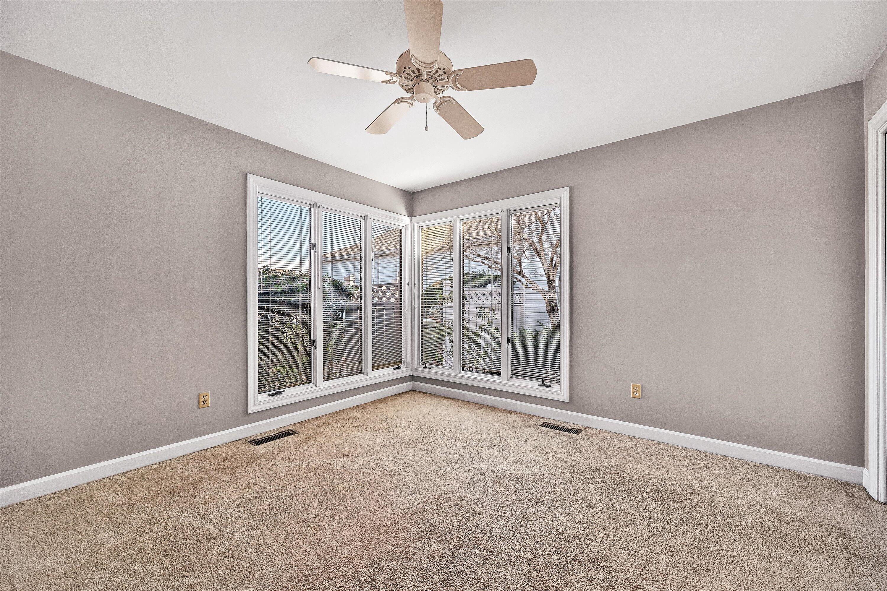 2537 South Clearing Road Salem, VA 24153 - Photo 14 of 28 an empty room with windows and ceiling fan