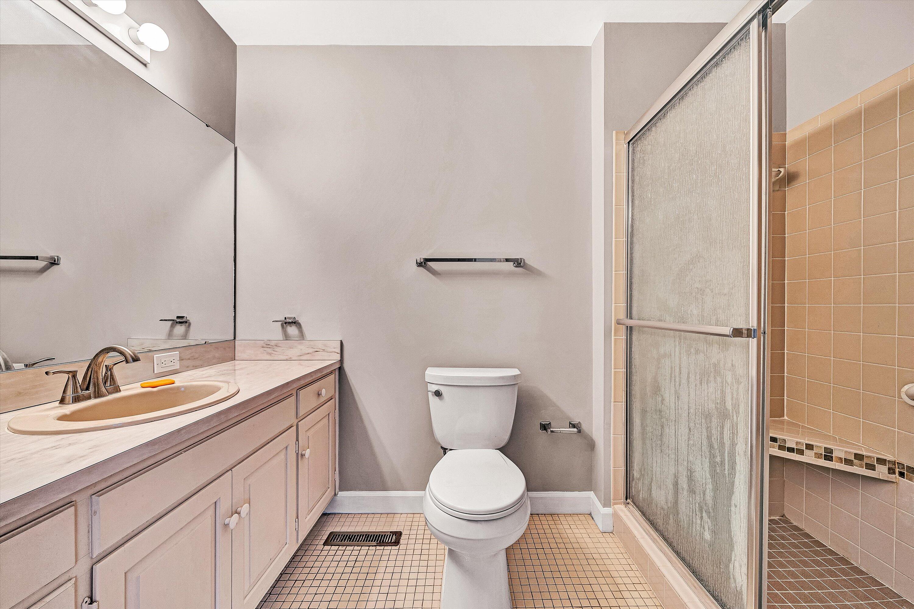 2537 South Clearing Road Salem, VA 24153 - Photo 18 of 28 a bathroom with a toilet sink and mirror