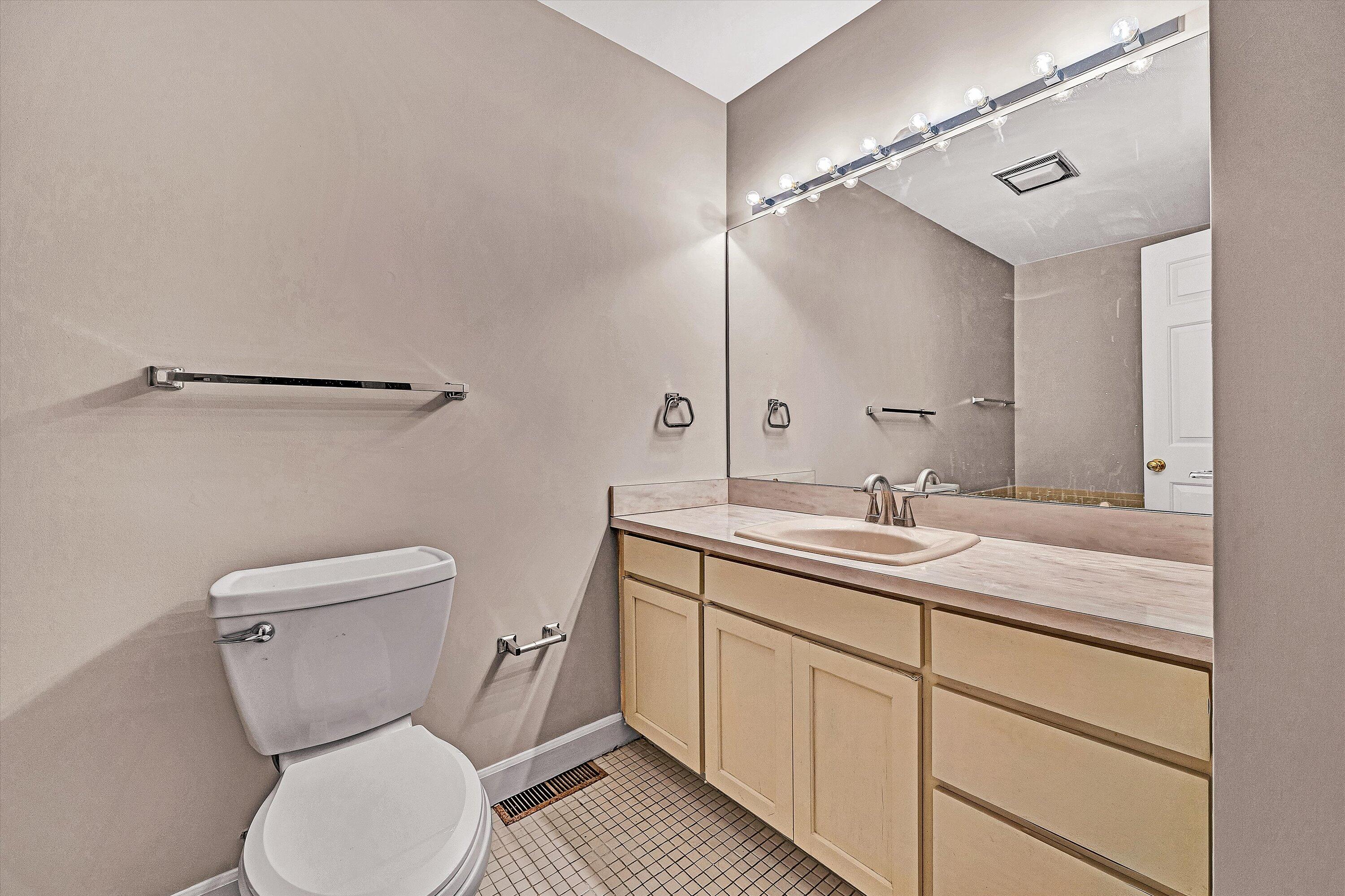 2537 South Clearing Road Salem, VA 24153 - Photo 20 of 28 a bathroom with a toilet sink and mirror