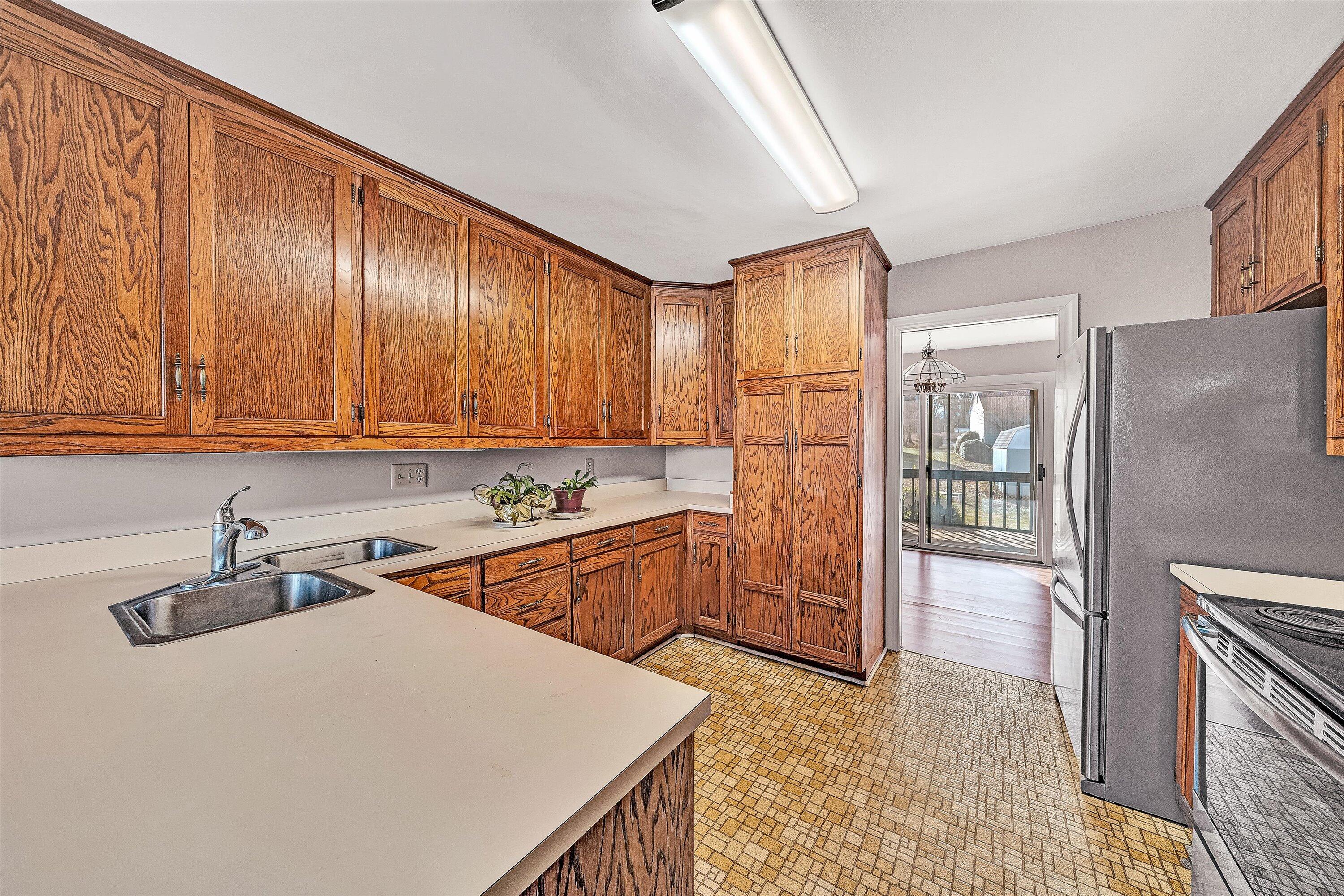 2537 South Clearing Road Salem, VA 24153 - Photo 7 of 28 a kitchen that has a sink a stove and a refrigerator