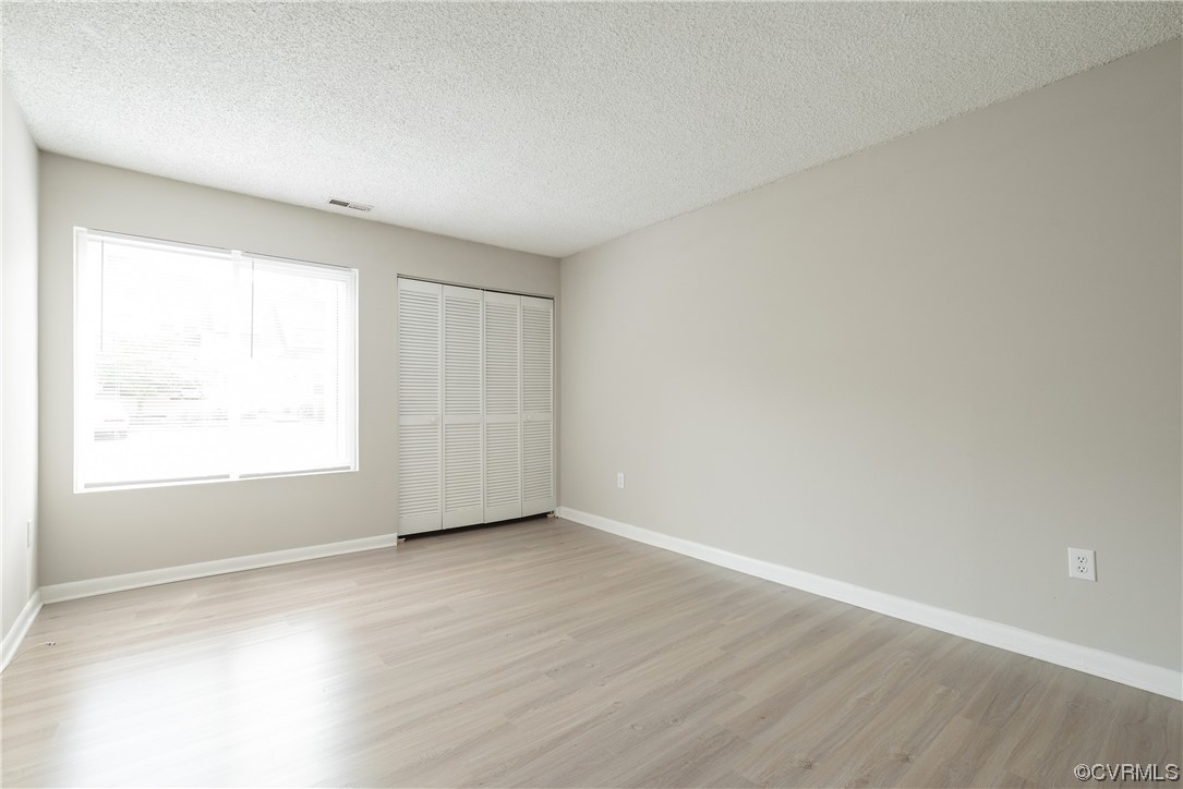 2675 Chancer Drive Henrico, VA 23233 - Photo 11 of 49 an empty room with wooden floor and windows