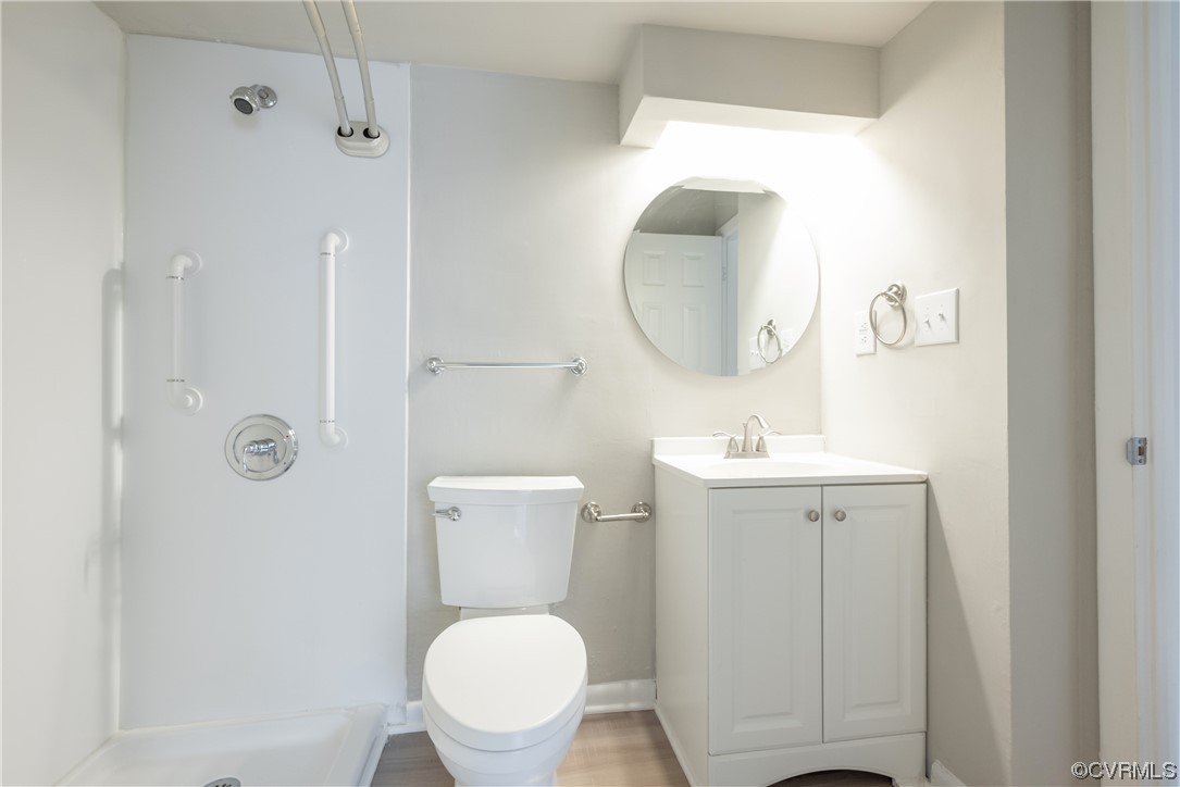 2675 Chancer Drive Henrico, VA 23233 - Photo 12 of 49 a bathroom with a toilet sink vanity and mirror