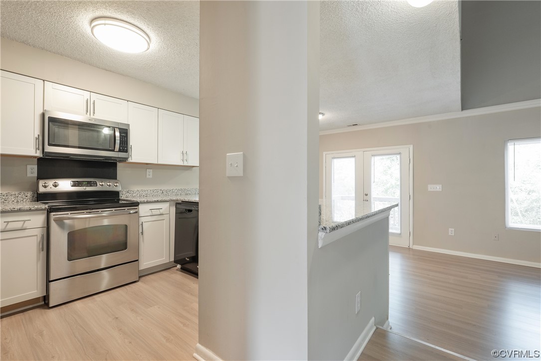 2675 Chancer Drive Henrico, VA 23233 - Photo 13 of 49 a kitchen with stainless steel appliances granite countertop a stove a microwave and a refrigerator
