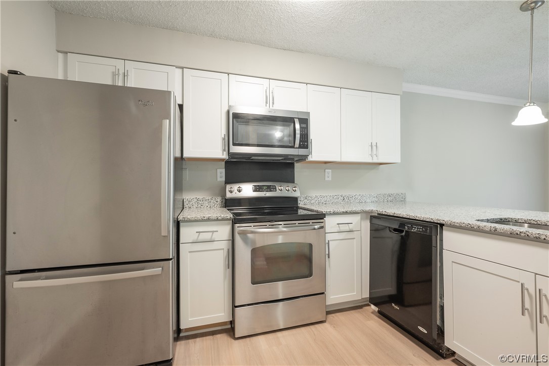 2675 Chancer Drive Henrico, VA 23233 - Photo 14 of 49 a kitchen with stainless steel appliances a refrigerator stove and microwave