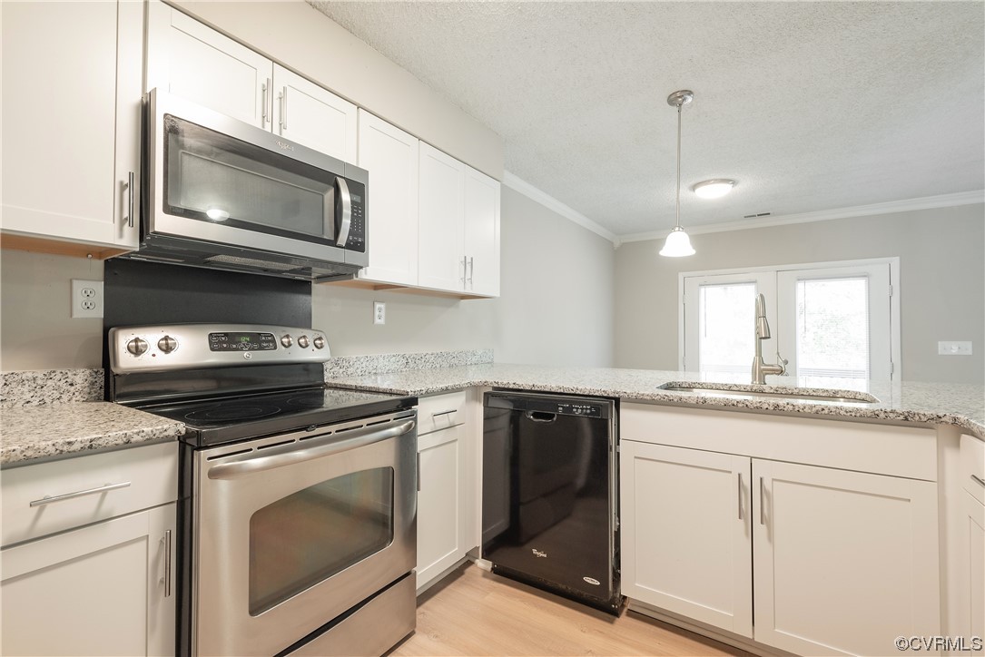 2675 Chancer Drive Henrico, VA 23233 - Photo 15 of 49 a kitchen with granite countertop white cabinets stainless steel appliances and a sink