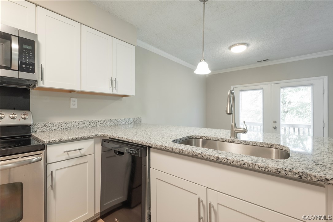 2675 Chancer Drive Henrico, VA 23233 - Photo 16 of 49 a kitchen with granite countertop a sink a stove and cabinets