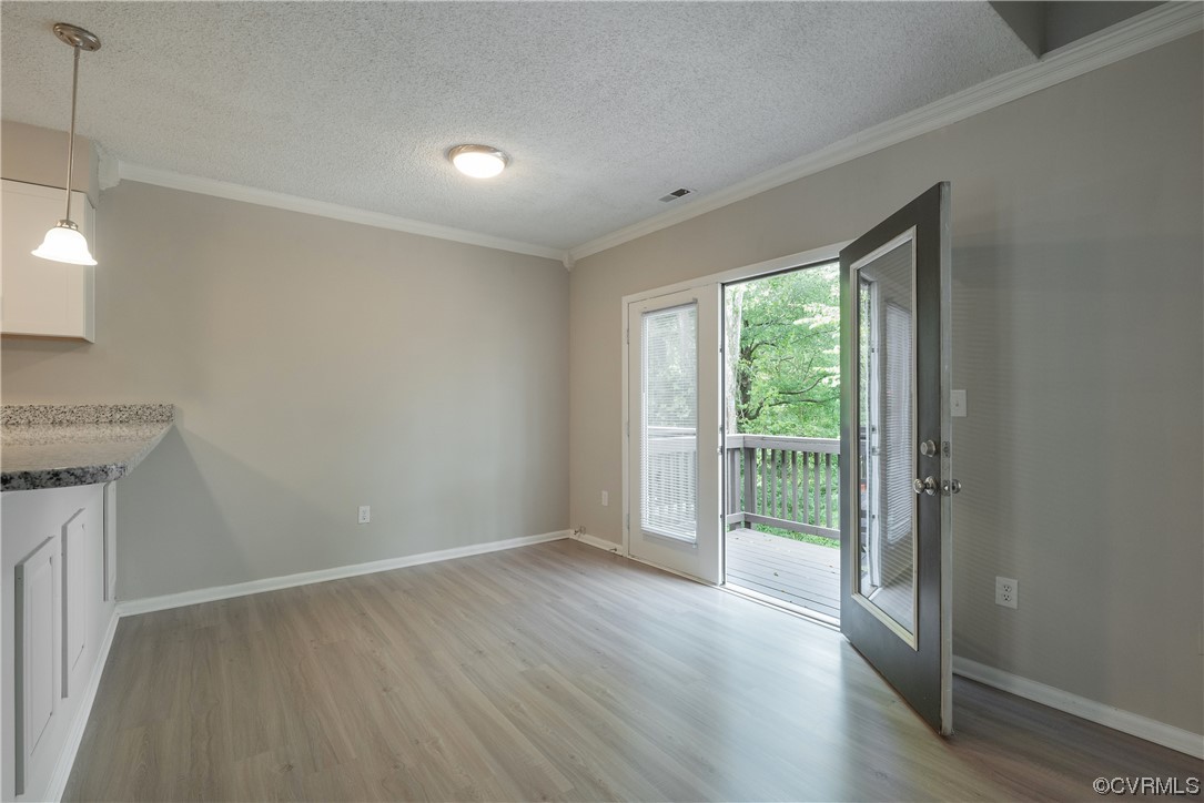 2675 Chancer Drive Henrico, VA 23233 - Photo 19 of 49 a view of an empty room with wooden floor and a window