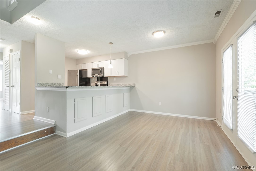 2675 Chancer Drive Henrico, VA 23233 - Photo 22 of 49 a kitchen with granite countertop a sink cabinets and wooden floor