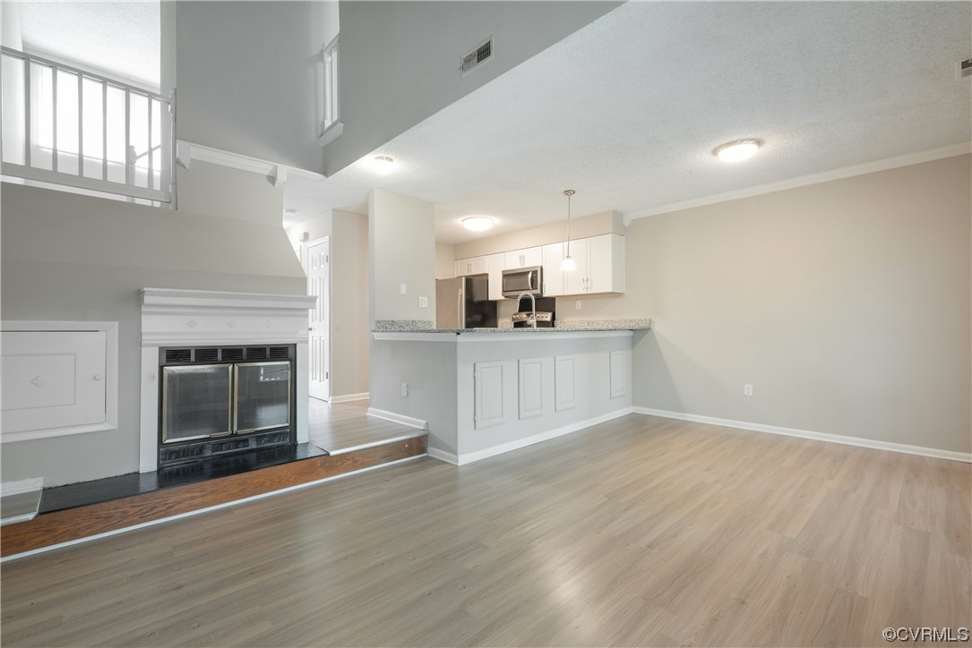 2675 Chancer Drive Henrico, VA 23233 - Photo 24 of 49 a view of a kitchen with a sink and a fireplace