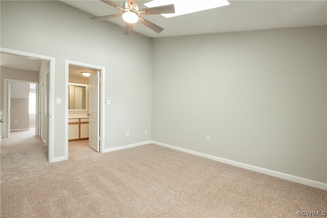 2675 Chancer Drive Henrico, VA 23233 - Photo 29 of 49 an empty room with a ceiling fan and bathroom view