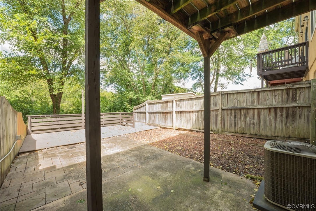 2675 Chancer Drive Henrico, VA 23233 - Photo 41 of 49 a view of a porch with a floor to ceiling window and wooden fence