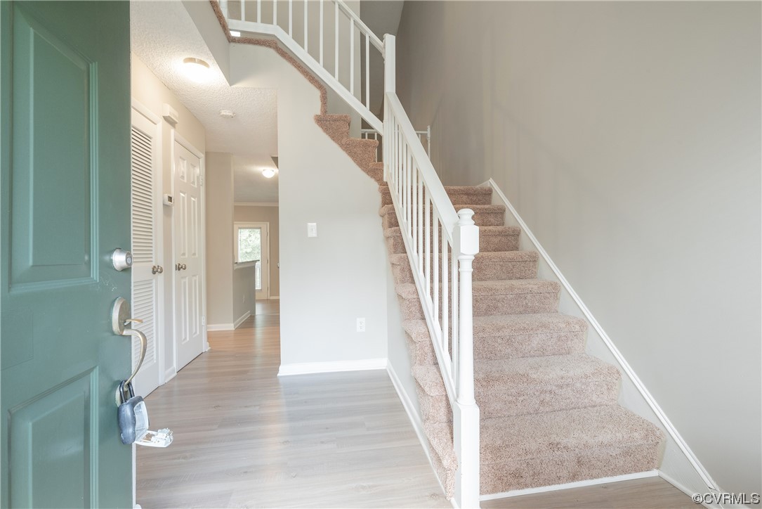 2675 Chancer Drive Henrico, VA 23233 - Photo 8 of 49 a view of a hallway with wooden floor and staircase