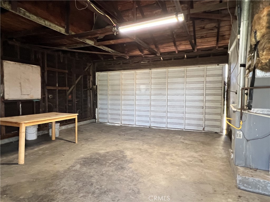 9467 Palm Lane Fontana, CA 92335 - Photo 11 of 13 a view of an empty room with storage