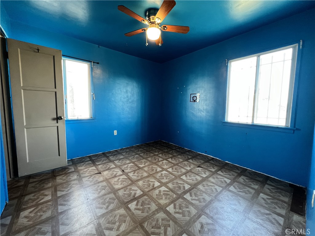 9467 Palm Lane Fontana, CA 92335 - Photo 4 of 13 a view of an empty room with a window
