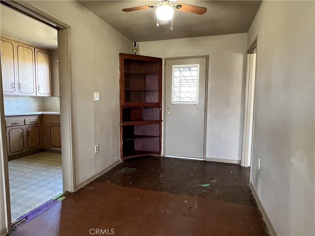 9467 Palm Lane Fontana, CA 92335 - Photo 10 of 13 an empty room with closet and windows