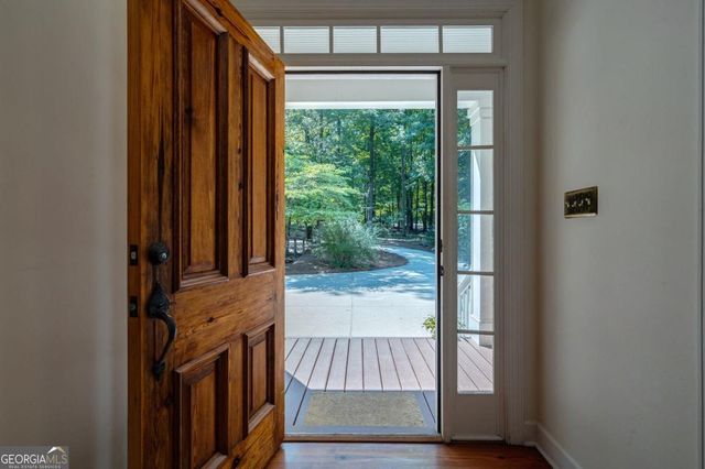 a view of a livingroom with an empty space and a fireplace