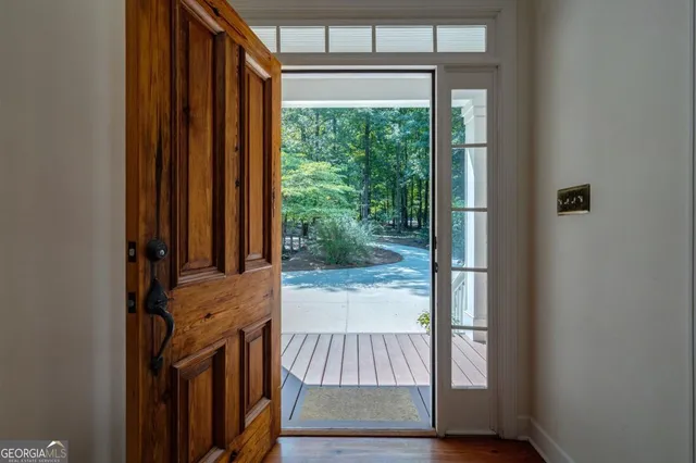 a view of a livingroom with an empty space and a fireplace