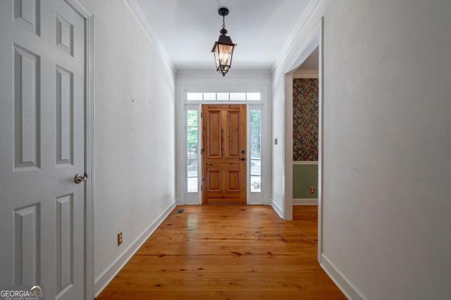 a bathroom with a sink a mirror and a window
