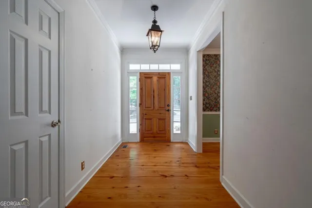 a bathroom with a sink a mirror and a window