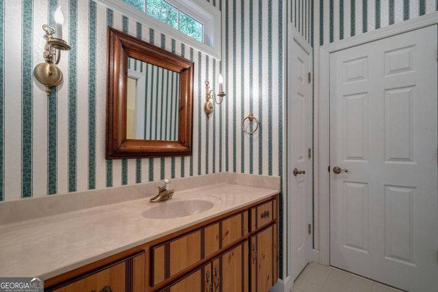 a view of a room with window wooden floor and a chandelier
