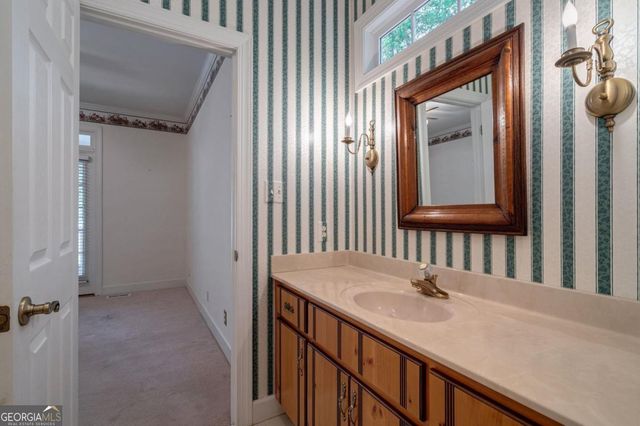 a kitchen with stainless steel appliances granite countertop wooden cabinets a sink and dishwasher