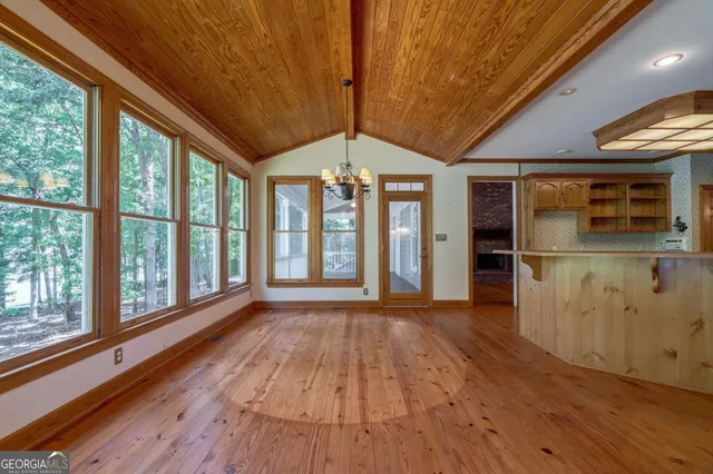 a spacious bathroom with a tub a double vanity sink and a mirror
