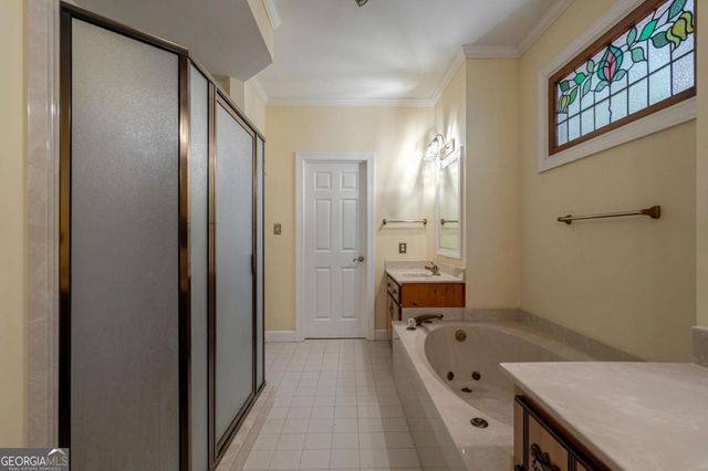 a kitchen with stainless steel appliances granite countertop a refrigerator a oven and a sink