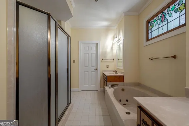 a kitchen with stainless steel appliances granite countertop a refrigerator a oven and a sink